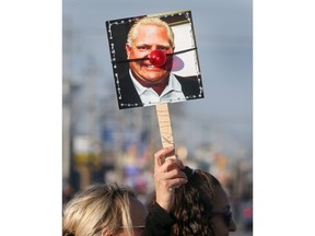 sex drugs A protest sign made by Windsor-Essex educational assistant Jocelyn Holmes clowning Ontario Premier Doug Ford. Photographed in Windsor on Nov. 4, 2022.