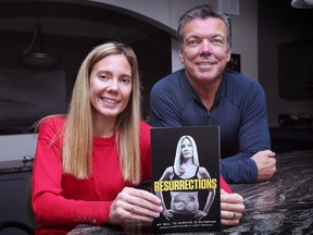 Danielle Campo McLeod and writer Marty Beneteau pose with a copy of her self-published memoir on Monday, November 28, 2022.