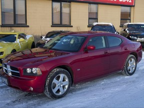 A 2010 Dodge Charger SXT AWD sits outside a car dealership in Calgary on Dec. 5, 2016.