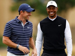 Golf - 150th Open Championship - St Andrews, Scotland, Britain - July 11, 2022 Tiger Woods of the U.S. and Northern Ireland's Rory McIlroy of Team Woods during the Celebration of Champions four hole tournament.