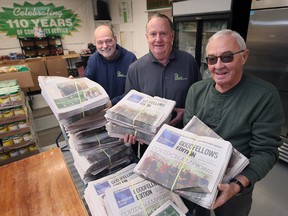 Brian Beaumont, left, Bruce Tate and Marcel Hinse, volunteers with the Windsor Goodfellows display the annual fundraising newspapers on Wednesday, November 23, 2022.