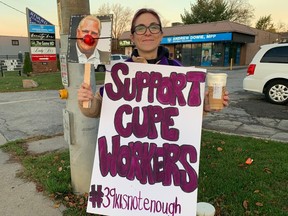 sex drugs Jocelyn Holmes, a Windsor-Essex educational assistant represented by CUPE, shows the signs she made to picket the constituency office of Windsor-Tecumseh MPP Andrew Dowie on Nov. 4, 2022.