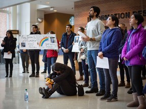 Dozens of students and faculty hold a rally for Iran at the University of Windsor's CAW Student Centre, on Wednesday, Nov. 30, 2022.