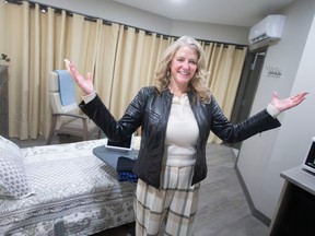 Nancy Lefebre, senior vice-president and chief operating officer of SE Health, unveils a patient suite at Journey Home Hospice Windsor-Essex, on Wednesday, Nov. 16, 2022.