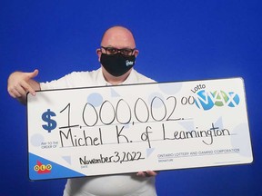 Michel Kassas of Leamington with his $1,000,000 prize cheque from playing Lotto MAX. Photo taken Nov. 3, 2022.