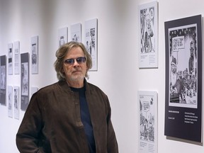 Former Windsor Star editorial cartoonist Mike Graston is shown at the University of Windsor's School of Creative Arts on Monday, November 14, 2022 where an exhibition of his work is being held.