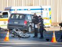 Windsor police officers at the scene of a collision between a minibus and a motorcycle on Tecumseh Road East and Kildare Road in Windsor on Nov. 10, 2022.