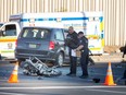 Windsor police officers at the scene of a collision between a minivan and a motorcycle at Tecumseh Road East and Kildare Road in Windsor on Nov. 10, 2022.