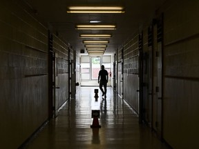 A person walks in the hall at a school in Scarborough, Ont., on Sept. 14, 2020.