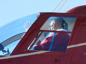 Santa Claus waves from the cockpit of a helicopter landing at Windsor's Devonshire Mall in November 2019.