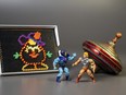 This undated photo provided by The Strong Museum shows the three toys inducted into the National Toy Hall of Fame in Rochester, N.Y., Nov. 10, 2022. Masters of the Universe, Lite-Brite and the top were chosen from among 12 finalists for the annual honour, which recognizes toys that have inspired creative play and lasting popularity.