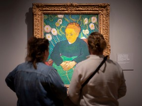 Visitors to the Detroit Institute of Art take in the museum's Van Gogh in America exhibit, on Wednesday, Nov. 9, 2022.