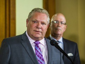 Ontario Premier Doug Ford and Minister of Municipal Affairs and Housing Steve Clark, address media outside of the Premier's office at Queen's Park in Toronto, Ont. on Monday, May 27, 2019.