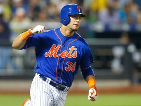 Michael Conforto of the New York Mets reacts after his seventh inning game-tying two-run home run against the Pittsburgh Pirates at Citi Field on August 15, 2015 in the Flushing neighborhood of the Queens borough of New York City.