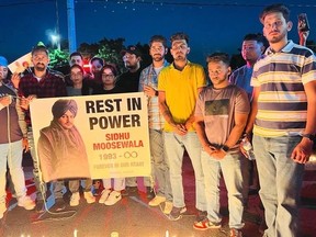 Honey Singh (red plaid shirt on the left) organized this candlelight vigil in May just days after Moose Wala was killed in a hail of bullets. Hundreds attended the gathering to mourn.