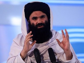 Afghan Taliban's acting Interior Minister Sirajuddin Haqqani speaks during the anniversary event of the departure of the Soviet Union from Afghanistan, in Kabul, April 28, 2022.