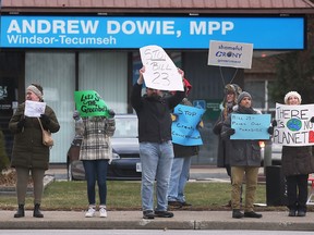 WINDSOR, ON. DECEMBER 3, 2022 -  Protestors are shown in front of MPP Andrew Dowie's constituency office on Saturday, December 3, 2022. They were opposing changes to Bill 23.