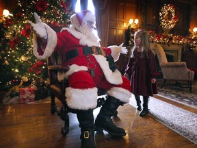 Alennia McKay, 4, meets the big guy at the Breakfast with Santa event on Sunday, December 18, 2022 at the Willistead Manor in Windsor.