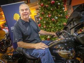 Brentwood Dream Home Lottery Early Bird Winner, Bob Moran, straddles his new Harley Davidson Street Glide he won in the 31st Annual Brentwood Dream Home Lottery, while at Thunder Road Harley Davidson, on Tuesday, Dec. 20, 2022.