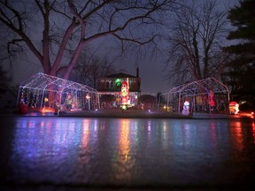 Windsor-Essex gets into the festive mood Christmas lights shine on a wet road on St. Mary's Boulevard in Windsor on Thursday, December 22, 2022.