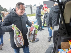 Liberal MP for Windsor-Tecumseh, Irek Kusmiercyzk, helps distribute 500 holiday food hampers to those in need, on Tuesday, Dec. 20, 2022.
