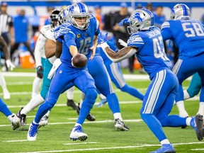 Detroit Lions quarterback Jared Goff hands off the ball to running back Justin Jackson during the first half against the Jacksonville Jaguars at Ford Field.