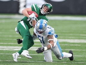 New York Jets wide receiver Braxton Berrios is tackled by Detroit Lions linebacker Josh Woods during the second half at MetLife Stadium.