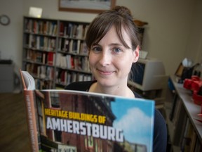 Meg Reiner is shown in Amherstburg on Wednesday, Dec. 7, 2002, with the book she authored, Heritage Buildings of Amherstburg.