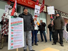 About 40 people joined a rally Monday outside the Windsor office of Windsor-Tecumseh MP Irek Kusmierczyk. The protest was part of national day of action calling on the federal government to make employment insurance (EI) reforms.
