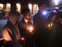 Family and friends of homicide victim Daniel Squalls participate in a candlelight vigil on Saturday, December 10, 2022 near Parent Avenue and Hanna Street.