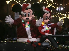 WINDSOR, ON. DECEMBER 3, 2022 -   Mickey and Minnie Mouse are shown during the 54th Annual Windsor Santa Claus Parade on Saturday, December 3, 2022 on Wyandotte Street East.