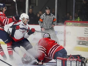 Windsor Spitfires' rookie forward Liam Greentree scores his second goal against Oshawa Generals' goalie Patrick Leaver while pressured by Calum Ritchie during Thursday's 7-2 win at the WFCU Centre.