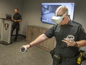 Constant Windsor Police Officer Nick Long demonstrates the service's new virtual reality mental health crisis response training.  Taken December 14, 2022.