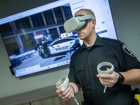 Const. Nick Long of Windsor police demonstrates the service's new Virtual Reality Mental Health Crisis Response Training. Photographed Dec. 14, 2022.