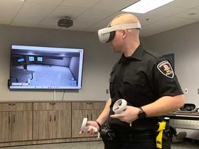 Const.  Windsor Police's Nick Long gets fit in the VR 'lobby' of Windsor Police's new virtual reality mental health crisis response training program.  Photographed on December 14, 2022.