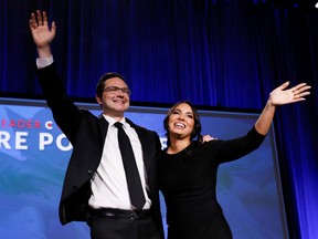 Pierre Poilievre and wife Anaida Poilievre wave onstage during Canada's Conservative Party leadership election in Ottawa September 10, 2022.