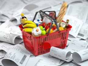 Shopping basket with food on a pile of receipts. Consumerism and grocery expenses budget. 3d illustration