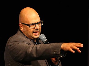 Canadian stand-up comedian Ali Hassan addresses an audience in 2016.