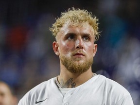 YouTube personality and boxer Jake Paul listens to the national anthem prior to the game between the Miami Marlins and the San Diego Padres at loanDepot Park.