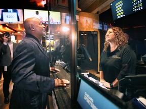 Hall of Fame goaltender Grant Fuhr places the first official bet at Caesars Windsor's new full-service sportsbook on Wednesday, January 11, 2023.
