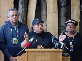Caldwell First Nation Chief Mary Duckworth, centre, speaks during a press conference on Wednesday, January 11, 2023 at the Ojibway Nature Centre in Windsor as councillor Doug Heil and cultural educator Liz Akiwenzie look on.