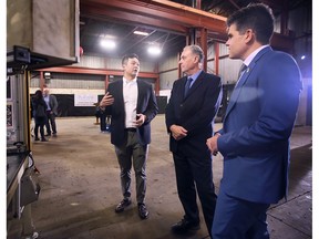 Steve Pan, director of operations at Porter Engineered Systems, left, speaks with Ontario Tory MPPs Rick Byers and MPP Andrew Dowie on Monday, Jan. 16, 2023, at the manufacturing company's Oldcastle facility.