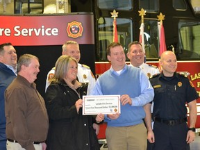 LaSalle Mayor Crystal Meloche, third from left, joins Enbridge Gas Windsor operations manager Brian Chauvin, fifth from left, for the presentation of a $5,000 donation from Enbridge Gas to the LaSalle Fire Service on Wednesday, Jan. 11. 2023, surrounded by Enbridge utility supervisor Ben Townsend, from left, Doug Kellam, Fire Marshal's Public Fire Safety Council board member, LaSalle Fire Chief Ed Thiessen, Deputy Chief Mark Seguin and training officer Capt. Justin Price.