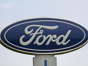 A Ford logo is seen on signage at Country Ford in Graham, N.C., on July 27, 2021.