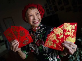 Catherine Fung, director of event planning with the Essex County Chinese Canadian Association, shows 'lucky money' envelopes on Jan. 18, 2023. The first day of the Lunar New Year is Jan. 22, 2023.