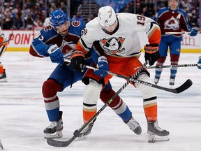 Colorado Avalanche left wing Matt Nieto and Anaheim Ducks right wing Troy Terry battle for the puck in the third period at Ball Arena.