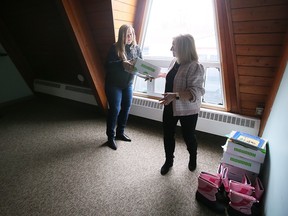 Moving out. House of Sophrosyne’s Sue McKinnon, left, and Karen Waddell are shown Monday at the organization’s long-time west-side facility that is now being vacated for a larger new Windsor home.