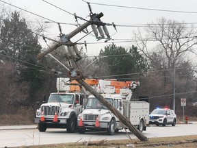 Hydro crews and police are shown on Ojibway Parkway near Morton Drive on Thursday, January 5, 2023. A truck took out a hydro pole and resulted in the closure of the westbound lanes for several hours and the loss of power to almost 3000 homes.