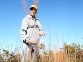 This Windsor Star file photo shows Mike St. Pierre on an Oct. 8, 2013 field trip with Windsor-Essex Catholic School Board students tasked with collecting seeds of native grasses and flowers at Point Pelee National Park. The students would then grow the seeds in a school greenhouse, returning the following spring to replant them in a savannah restoration sites. DYLAN KRISTY/Windsor Star