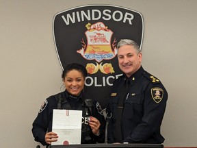 Windsor Police Chief Jason Bellaire (right) introduces Const. Melissa Jacob with a lifesaving award from St. John Ambulance on Tuesday, January 24, 2023, for saving the life of a suicidal person.